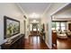 Elegant foyer with hardwood floors, a decorative console table, and views into the living room at 188 Macedonia Rd, White, GA 30184