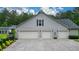View of the home's large three-car garage, offering ample parking and storage space at 188 Macedonia Rd, White, GA 30184