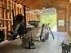 A look inside the garage featuring a boat on a trailer and wood paneled walls at 188 Macedonia Rd, White, GA 30184