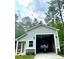 Inside the garage is a boat on a trailer, ready for the water at 188 Macedonia Rd, White, GA 30184