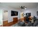 Bright office featuring hardwood floors, a large desk, and media setup for work or entertainment at 188 Macedonia Rd, White, GA 30184