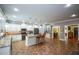 Well-equipped kitchen featuring granite countertops, white cabinetry, a center island with seating, and stainless steel appliances at 188 Macedonia Rd, White, GA 30184