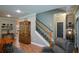 Inviting living area with a staircase and an antique china cabinet, perfect for Gathering gatherings and entertaining guests at 188 Macedonia Rd, White, GA 30184