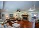 Living room features a brick fireplace, hardwood floors, and cozy seating arrangement at 188 Macedonia Rd, White, GA 30184