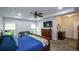 Bright primary bedroom features a tray ceiling, couch, and plenty of natural light at 188 Macedonia Rd, White, GA 30184