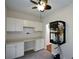 Bright office features built-in cabinets, a workspace, and server rack at 188 Macedonia Rd, White, GA 30184