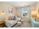 Charming bedroom with pastel accents, window view, and comfortable daybed at 1911 Colestock Se Ave, Conyers, GA 30094