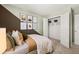Relaxing bedroom with geometric wall design, plush bedding, and spacious closet at 1911 Colestock Se Ave, Conyers, GA 30094