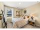 Cozy bedroom with soft lighting, a comfortable bed, and a stylish nightstand with decor at 1911 Colestock Se Ave, Conyers, GA 30094