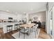 Dining area adjacent to kitchen boasts granite counters, stainless appliances, and slider at 1911 Colestock Se Ave, Conyers, GA 30094