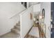 Bright foyer featuring a staircase, wood floors, and a decorative console table at 1911 Colestock Se Ave, Conyers, GA 30094