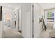 Upstairs hallway with carpet and bedroom views at 1911 Colestock Se Ave, Conyers, GA 30094