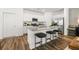 Bright modern kitchen features stainless appliances, granite counters, and island seating at 1911 Colestock Se Ave, Conyers, GA 30094