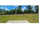 View of the backyard and treeline from the concrete patio at 1961 Ecoland Dr, Grayson, GA 30017