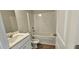 Bathroom with full tub and shower combination, toilet, and a sink at 1961 Ecoland Dr, Grayson, GA 30017