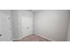 Clean, carpeted bedroom with neutral walls, double door closet, and good lighting at 1961 Ecoland Dr, Grayson, GA 30017