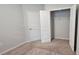 A bedroom with an open closet and neutral carpeting provides a cozy and inviting atmosphere at 1961 Ecoland Dr, Grayson, GA 30017