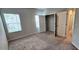 Spacious carpeted bedroom with large windows and closet at 1961 Ecoland Dr, Grayson, GA 30017
