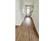 Inviting entryway with wood-look floors, white walls, and a staircase at 1961 Ecoland Dr, Grayson, GA 30017