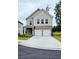 Attractive two-story home with a stone and brick exterior, an attached two-car garage, and a spacious driveway at 1961 Ecoland Dr, Grayson, GA 30017