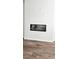 Modern fireplace set into the wall with wood-look flooring at 1961 Ecoland Dr, Grayson, GA 30017