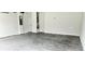 View of the garage with painted walls and floor at 1961 Ecoland Dr, Grayson, GA 30017