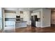 A bright kitchen featuring an island, stainless steel appliances, and plentiful cabinet space is a chef's dream at 1961 Ecoland Dr, Grayson, GA 30017