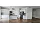Bright kitchen features stainless steel appliances, granite countertops, and wood-look floors at 1961 Ecoland Dr, Grayson, GA 30017