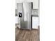 Close-up of stainless steel refrigerator in kitchen with granite countertops at 1961 Ecoland Dr, Grayson, GA 30017