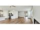 Open-concept living space with stainless steel kitchen appliances, hardwood floors, and ample natural light at 1961 Ecoland Dr, Grayson, GA 30017