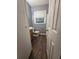 Bathroom featuring a wood vanity, toilet and window with blinds at 2802 3Rd Sw Ave, Atlanta, GA 30315