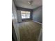 A bedroom with gray walls, neutral carpet, and window at 2802 3Rd Sw Ave, Atlanta, GA 30315