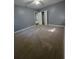 Bedroom with neutral walls, plush carpet, ceiling fan, and closet for a modern, comfortable space at 2802 3Rd Sw Ave, Atlanta, GA 30315