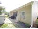View of the backyard featuring a screened-in porch, and a well-maintained lawn at 414 Norton Xing, Woodstock, GA 30188