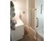 Bathroom featuring a shower, sink and towel rack and multiple rolled up towels at 414 Norton Xing, Woodstock, GA 30188