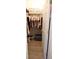 Walk-in closet with hanging clothes and organized storage shelves at 414 Norton Xing, Woodstock, GA 30188