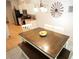 Eat-in kitchen featuring a wooden dining table with a bowl of oranges as centerpiece at 414 Norton Xing, Woodstock, GA 30188