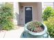 Close-up front door with a flower pot in the foreground at 414 Norton Xing, Woodstock, GA 30188