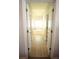 Hallway leads to bright bathroom with soaking tub and natural light at 414 Norton Xing, Woodstock, GA 30188