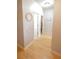 Bright hallway featuring hardwood floors and neutral walls at 414 Norton Xing, Woodstock, GA 30188