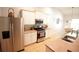Stainless steel appliances in this kitchen with white cabinets and light countertops at 414 Norton Xing, Woodstock, GA 30188