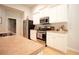 Modern kitchen features stainless steel appliances and bright white cabinets at 414 Norton Xing, Woodstock, GA 30188