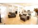 Open-concept living room and kitchen with modern decor and plenty of natural light at 414 Norton Xing, Woodstock, GA 30188