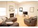 A spacious living room offers a fireplace and comfortable seating, creating an inviting atmosphere at 414 Norton Xing, Woodstock, GA 30188