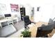 Bright home office with a desk, monitors, natural light, and a dog bed at 414 Norton Xing, Woodstock, GA 30188