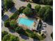 Aerial view of a community pool surrounded by lush greenery and lounge chairs at 414 Norton Xing, Woodstock, GA 30188