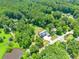 Aerial view showcases the home surrounded by lush greenery, providing a private and picturesque setting at 4829 Moon Rd, Powder Springs, GA 30127