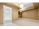 Bathroom through doorway adjacent to large bedroom with tray ceilings and pendant lighting at 4829 Moon Rd, Powder Springs, GA 30127