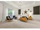 Bright bedroom features tray ceilings, carpet floors, large windows and a cozy seating area at 4829 Moon Rd, Powder Springs, GA 30127