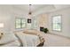 Bright, large bedroom featuring fireplace and large windows, with decorative lighting and neutral carpet at 4829 Moon Rd, Powder Springs, GA 30127